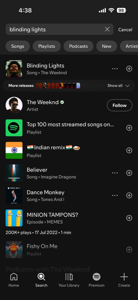 Spotify search submit for blinding lights with top song artist and mixed catalog results